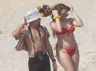 Redhead MILF with perfect body comes to beach