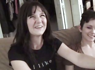 Two brunettes use a strapon while playing lesbian games indoors