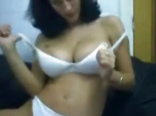 Busty brunette babe on webcam teasing and seducing with her sexy body and big boobs