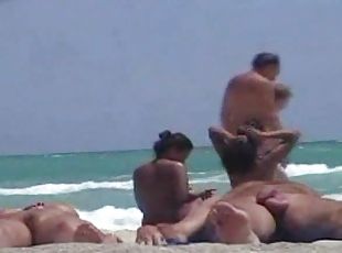 Voyeur's cam catches an Asian pussy on a nude beach