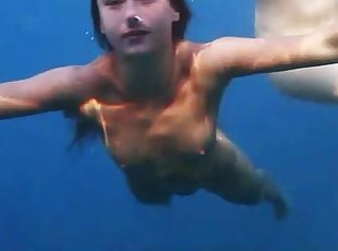 See lean naked bodies underwater in ocean