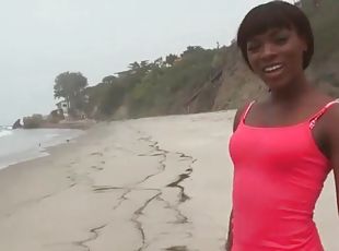 Black chick on the beach in skintight yoga pants