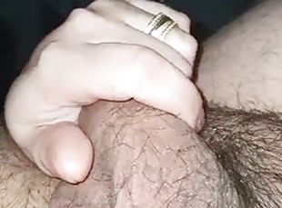 Stepmoms hand slides on her stepsons cock while he watches some porn on TV