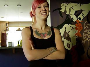 Tattooed teen with a hot body playing with her shaved pussy