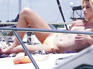 Slutty blonde in a bikini gets fucked on a rich man's boat