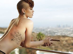 Short-haired Britt Linn has a Playboy photo shoot on the poolside