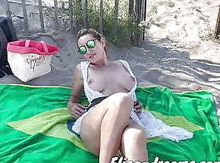 Naughty at beach in front of a lot of voyeurs