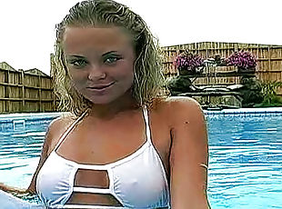 Bikini girl goes topless in pool