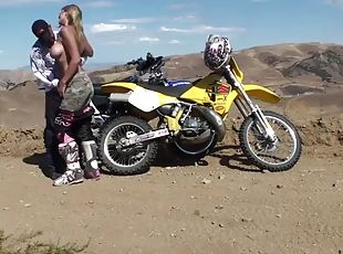 Hot sex with a busty motocross babe outdoors