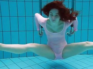 Teen in a leotard goes for a sexy swim