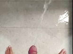 Standing piss naked in the shower, playing with my cock and my piss stream hits my feet