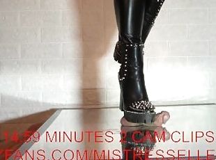 Mistress elle presents her spiked boots to her slave