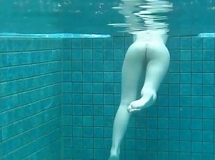 Skinny dipping Japanese girl has a shaved pussy