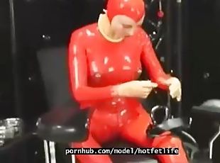 Hot girl full encased in red rubber suit enjoys gas mask breathplay in her black room