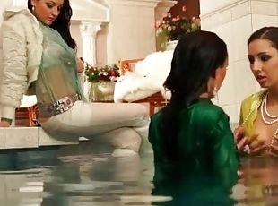 Fully clothed women take a dip in the pool