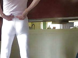 Male slut in skin-tight white spandex leggings.