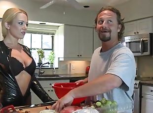 Blonde MILF in a leather bodysuit gets nailed in a kitchen