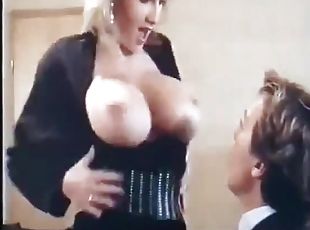 Busty blonde milf gives an ardent blowjob in a hot retro clip