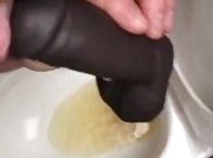 POV Pissing thru my hollow cock sleeve device in a public washroom then tasting the last few P drops