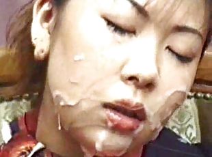Japanese girl gets messy in bukkake