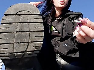 Dirty boot soles for you! Dominatrix Nika is smoking on the beach and you have to lick her dirty boot soles. Boot fetish