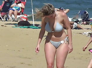 Booty beauty in bikini on the beach
