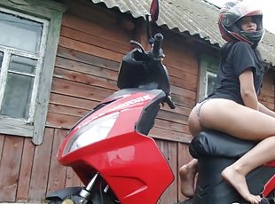 Biker girl masturbates on her red motorcycle