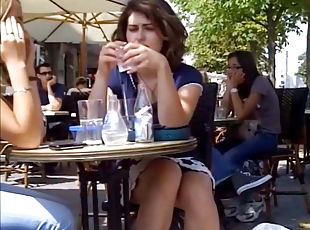 Brunette in a summer café teasing