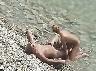 Sexy Blonde Babe Gives her Boyfriend a Blowjob on a Beach