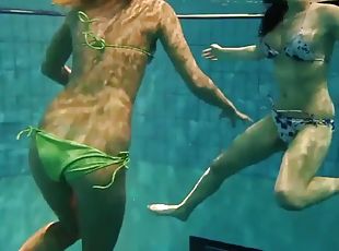 Girls Andrea and Monica undress each other underwater
