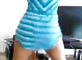 Amateur girl wearing a minidress shakes her butt in front of a webcam
