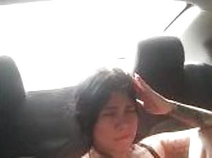 Horny slut fucks her pussy with a dildo in the back seat of an Uber.