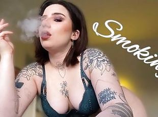 Sexy smoking alternative tattooed model in lingerie