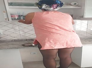 Mature turkish mom doing her daily chores in the kitchen