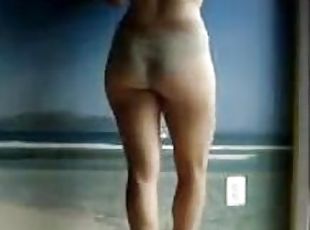 Homemade video of sexy chick masturbating in stand up pose