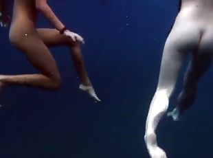 Submerged hot babes underwater