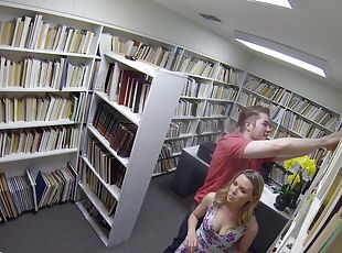 Aubrey Sinclair rides a fellow's erected cock in a library