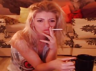 Smoking blonde stripteasing and having fun on webcam