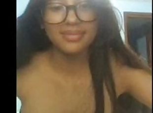 Latina on webcam shows her hairy pussy