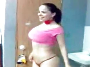 Big-breasted Latina babe goofs around walking naked