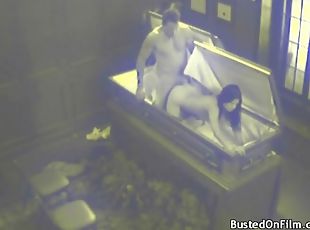 Naughty couple has hardcore sex in a coffin