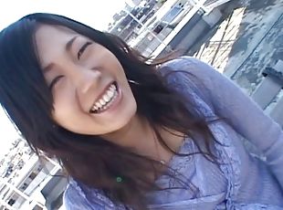 Toying with an Asian girlfriend's hairy pussy outdoors