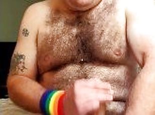 Hairy tattooed guy jerks off big cock, fingers tight little asshole, cums on chest, eats cum