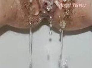 Meaty hairy pussy pissing close up