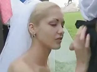 Bride sucks cock in a field on wedding day