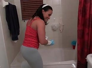 Spandex pants cling to her big ass as she cleans