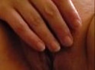 Wife laying in bed rubbing her pussy having fantasies