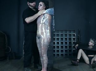 Slender brunette babe Alex More wrapped in plastic and abused hardcore