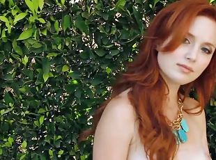 Molly Shaw the horny redhead girl lies naked on the lounge