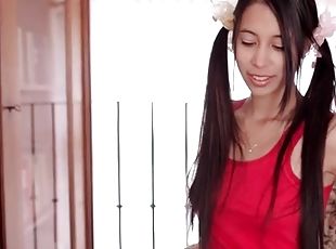 Skinny brunette with long hair in pigtails